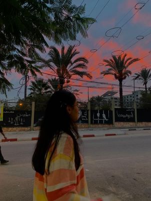 Tala Albanna looking at Sunrise in Gaza City