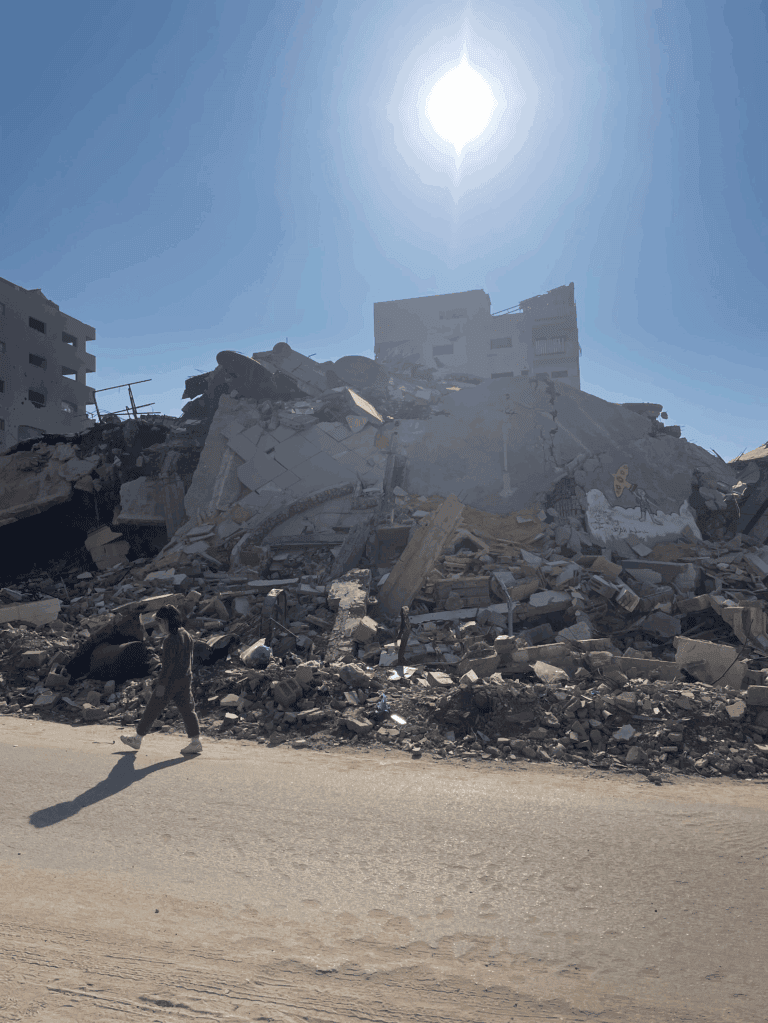 Child walking near a destroyed building in Gaza