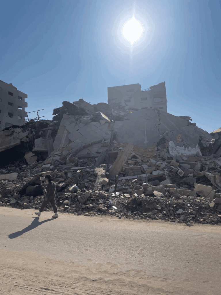Child walking near a destroyed building in Gaza