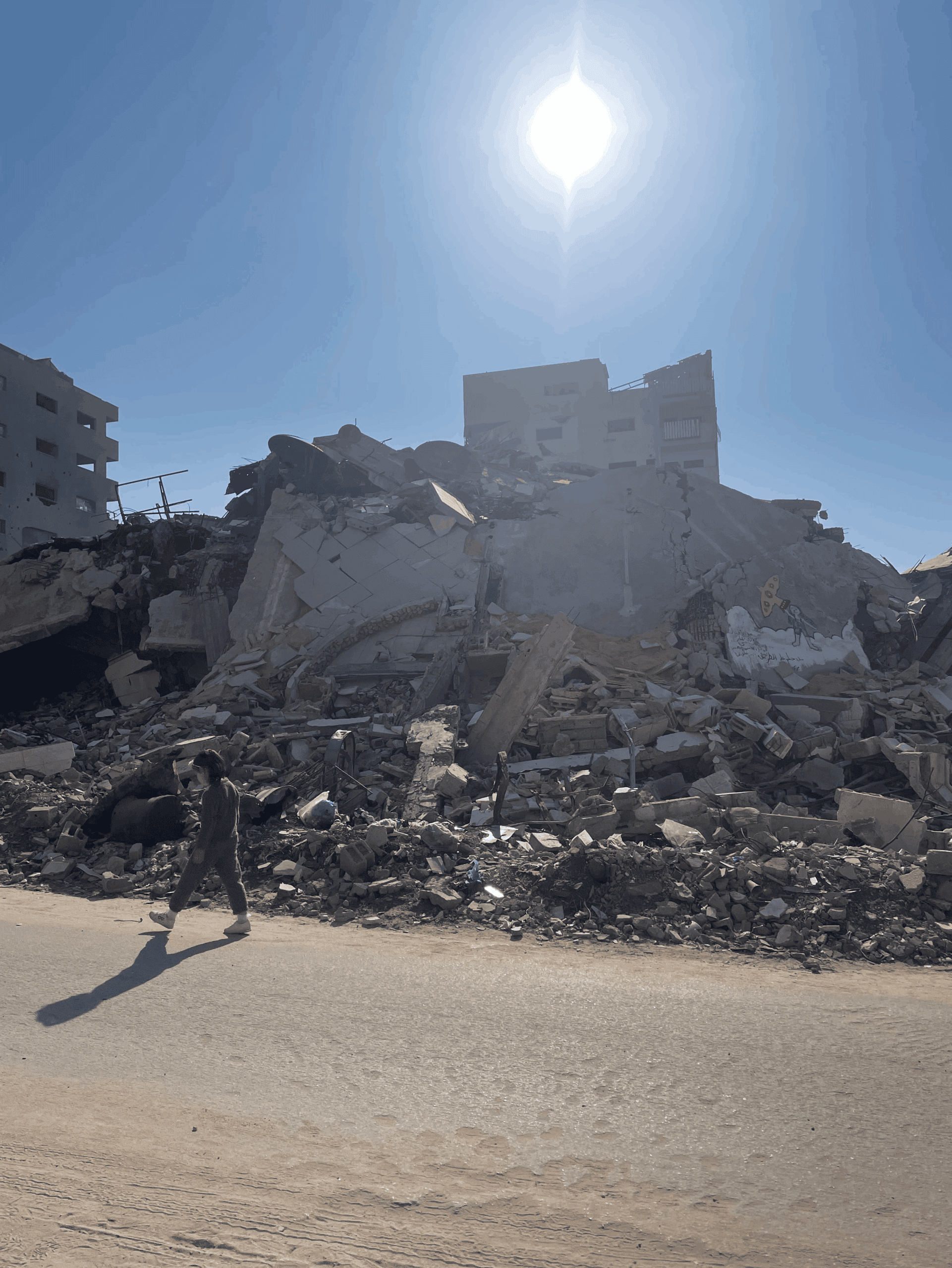 Child walking near a destroyed building in Gaza