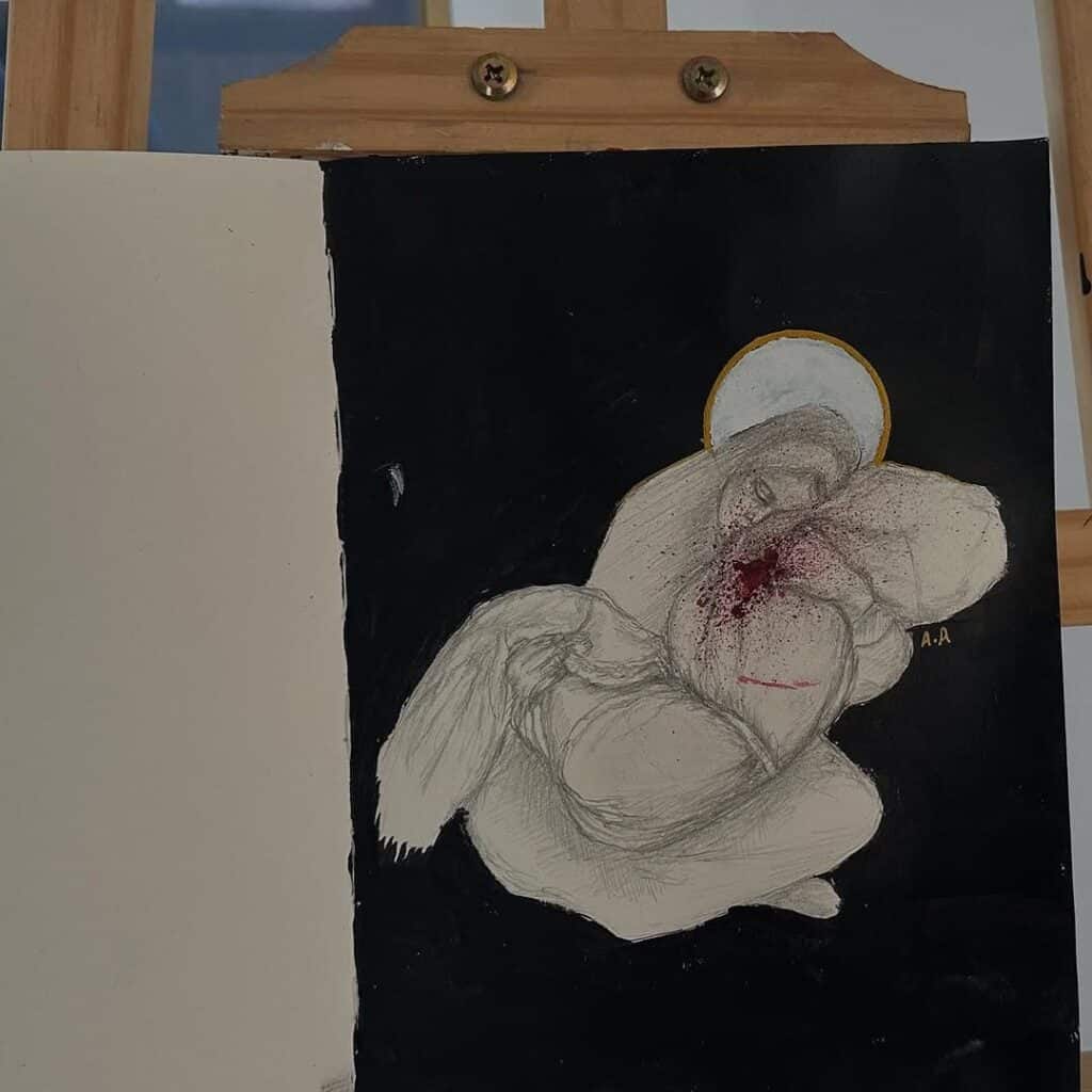 A woman holding a blood stained child.