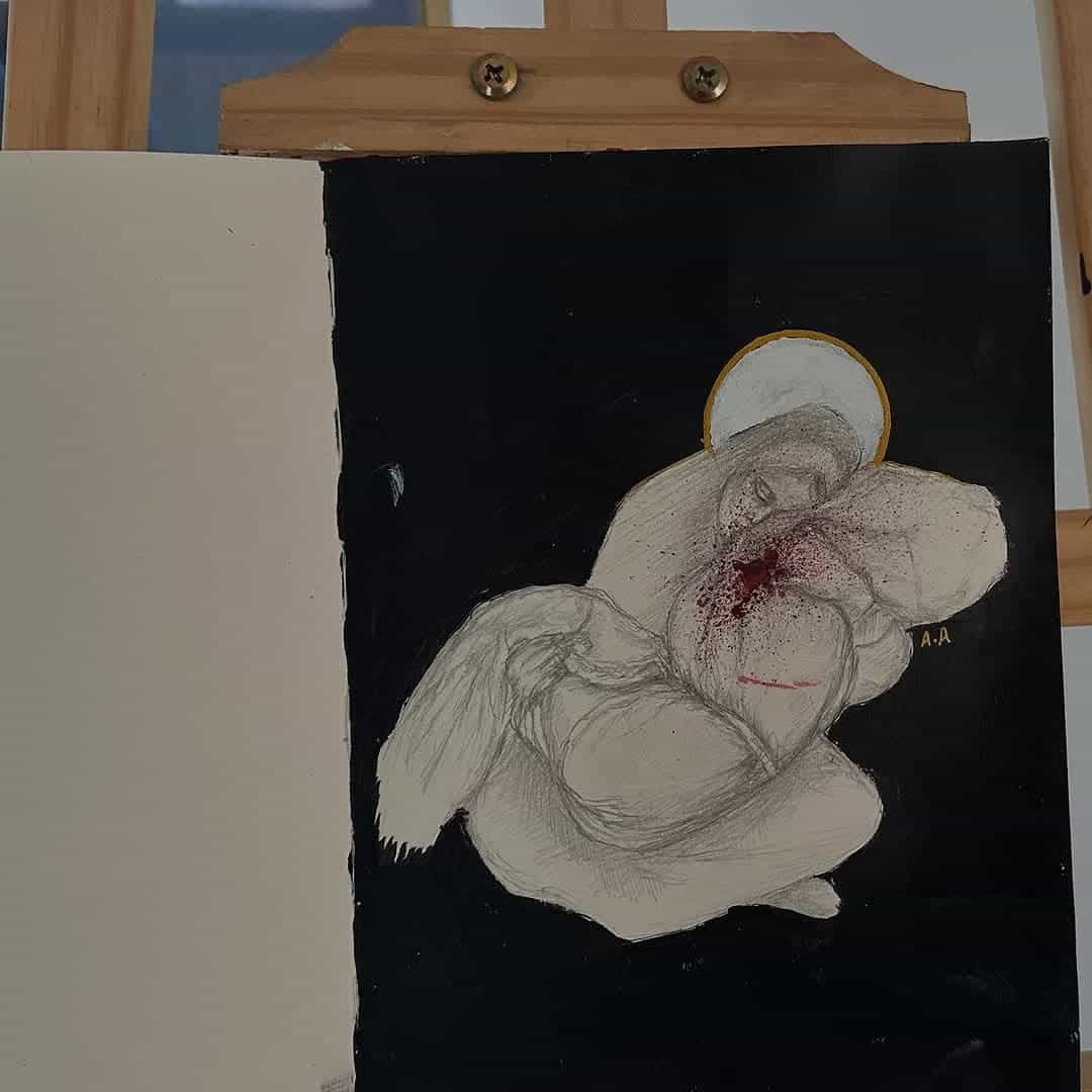 A woman holding a blood stained child.